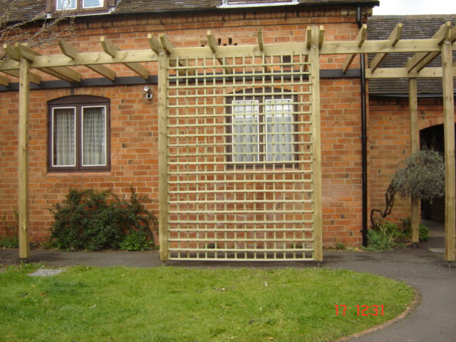 afterwards we got it looking exactly the same, this surrounded the whole building and was hard work but the wood is pressure treated so can stay this colour unless they choose to change it in Rugby