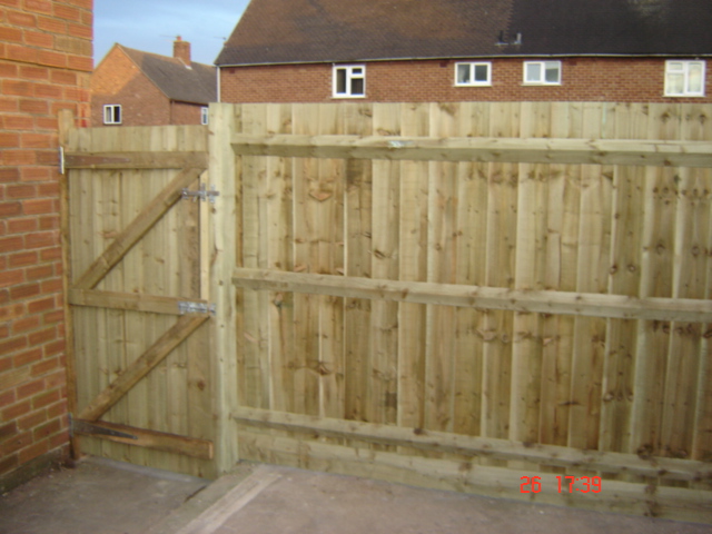 Awkward partially raised garden needed fencing and gates to match Bishops Tachbrook