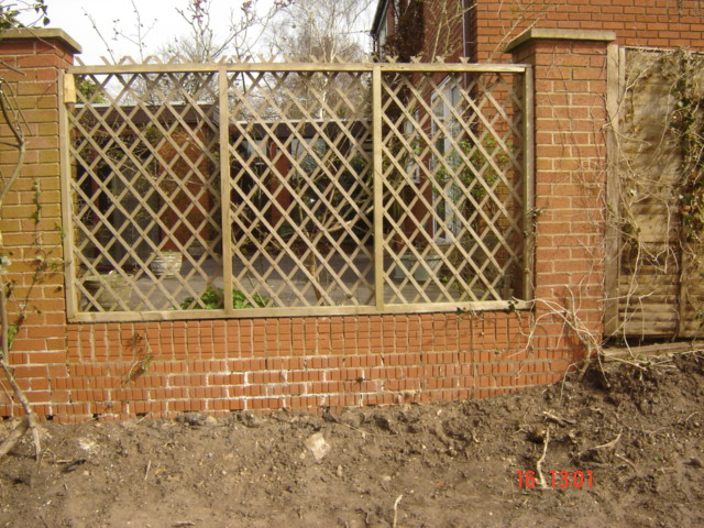 New Wood Trellis fitted to a brick wall Solihull