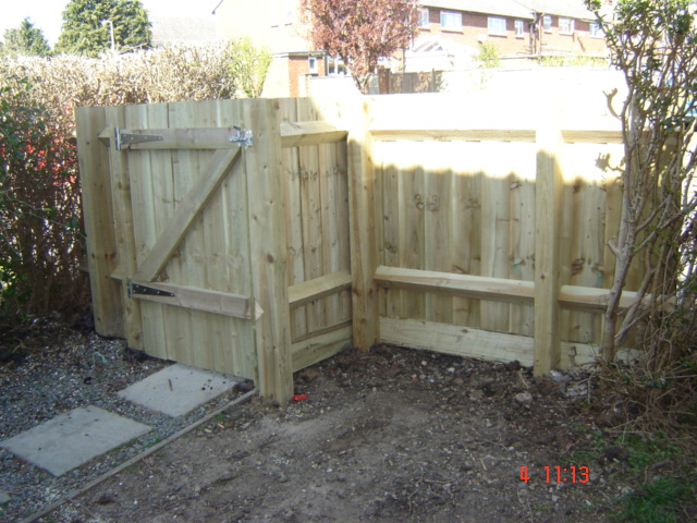 Hand made to fit awkward space wood feather board fence and gate Leamington Spa