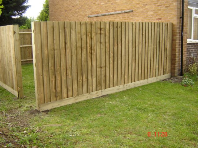 Council properties with upgraded fencing to public areas with wooden featherboard